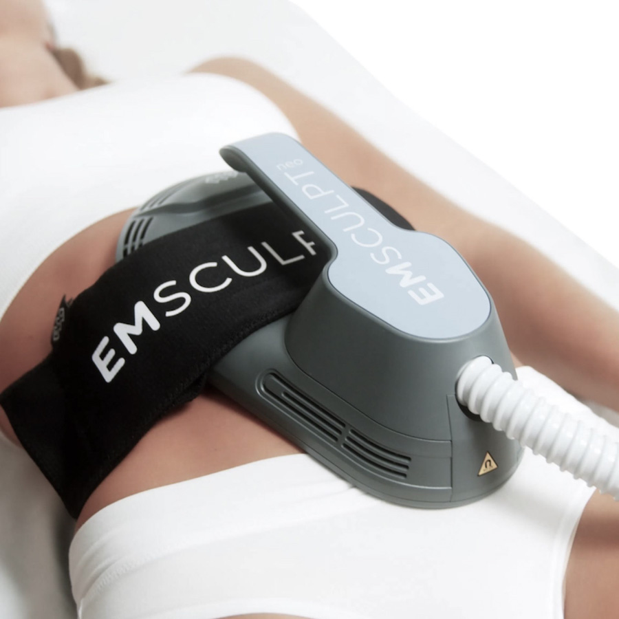 EMSculpt device on a patient's abdomen EMSculpt device on a patient's abdomen