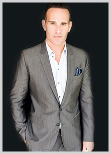 Dr. Paul Jarrod Frank of PFRANKMD portrait in grey suit Dr. Paul Jarrod Frank of PFRANKMD portrait in grey suit