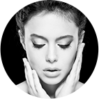 Round cropped image of a woman with hands on her face Round cropped image of a woman with hands on her face