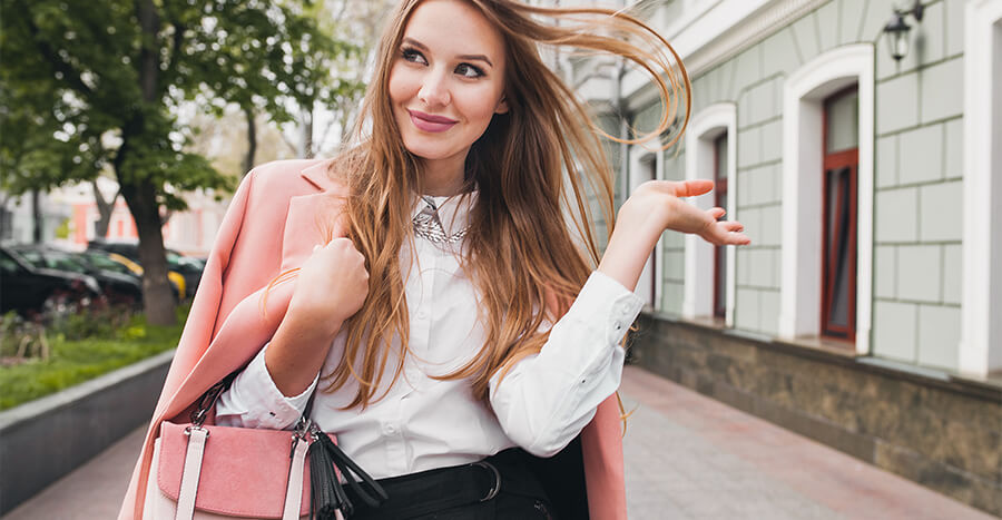 Woman flicking hair and smiling Woman flicking hair and smiling